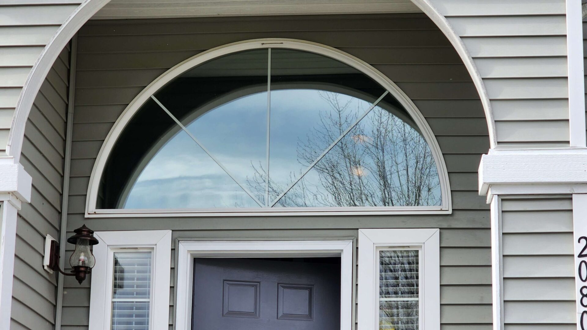 Home window film installation providing privacy and energy efficiency.